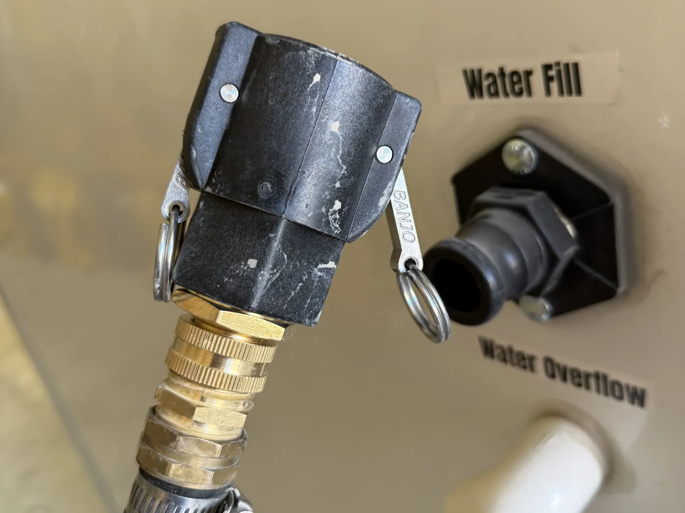 Water Fill cam lock port and Water Overflow outlet on the outside of the box